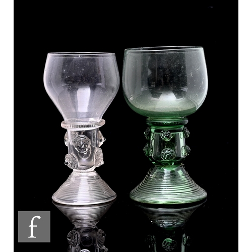 347 - An 18th Century continental Roemer glass in sea green, the ovoid bowl above an integral stem with ap... 