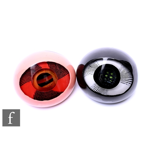 351 - A pair of contemporary studio glass paperweights of compressed ovoid form each cased in colours and ... 