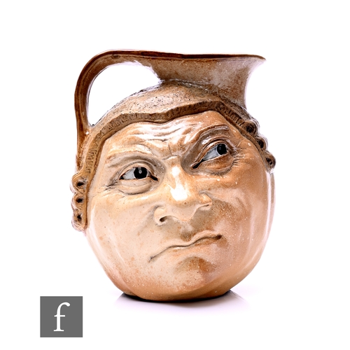 173 - Robert Wallace Martin - Martin Brothers - A stoneware characterful Barrister face jug, circa 1910, m... 