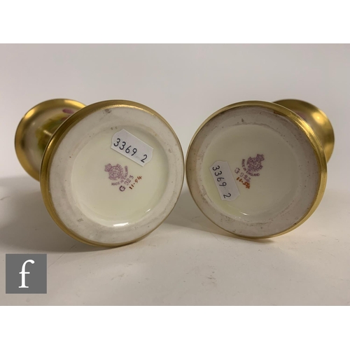 11 - Kitty Blake for Royal Worcester, a pair of fruit painted vases, circa 1935, of trumpet form, decorat... 