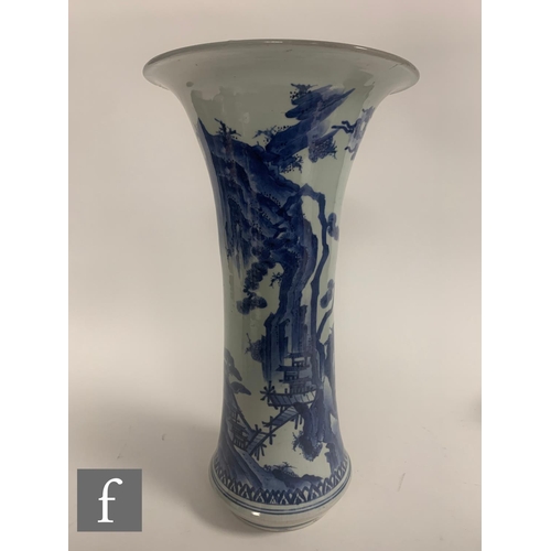 375 - A matched pair of Chinese blue and white Kangxi style vases, each of the slender trumpet form vase, ... 