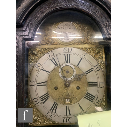 749 - An 18th Century and later carved oak longcase clock by Henry Pye Falmouth, silvered chapter ring and... 