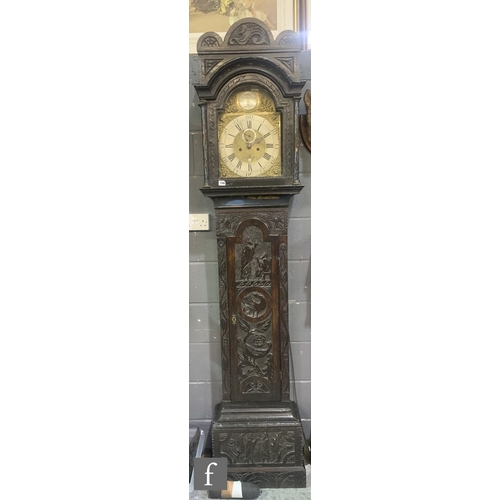 749 - An 18th Century and later carved oak longcase clock by Henry Pye Falmouth, silvered chapter ring and... 