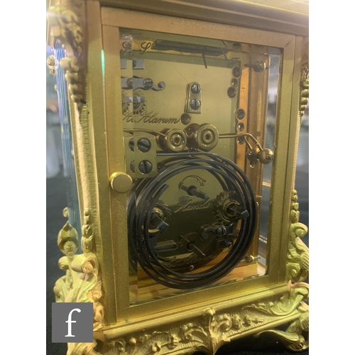 754 - A late 19th to early 20th Century French gilt carriage clock, Arabic dial and second subsidiary dial... 