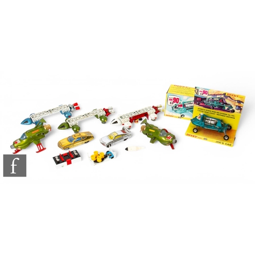 A group of Dinky Gerry Anderson TV related diecasts including, three Space: 1999 Eagle Transporters, Shado UFO interceptors, Joe 90 Joe's Car with reproduction box and inner, Sam's Car and Ed Strakers Car, playworn. (8)