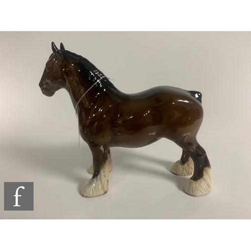 65 - A Beswick pottery figure of a shire horse, with plaited mane, height 21cm, together with a Beswick c... 