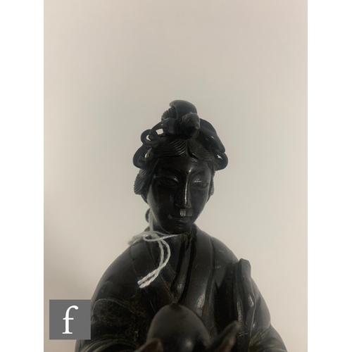 387 - A Japanese late Meiji Period (1868-1912) figure of Shou Lao, modelled dressed in robes and holding a... 