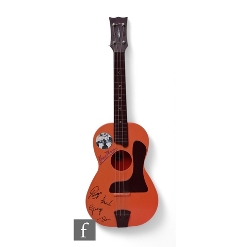 930 - Selcol - A New Beat plastic Beatles guitar with facsimile signatures, length 80cm, slight damage.