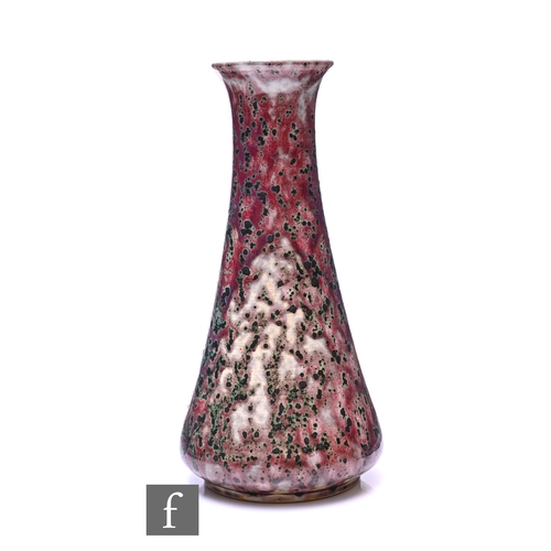 186 - Ruskin - An early 20th Century high fired vase of conical form, sang de beouf glaze with heavy coppe... 