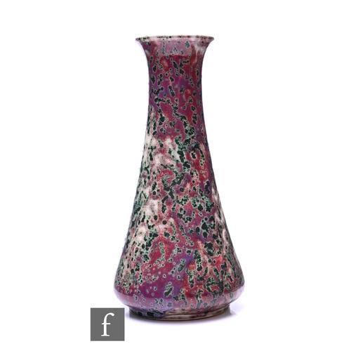 186 - Ruskin - An early 20th Century high fired vase of conical form, sang de beouf glaze with heavy coppe... 