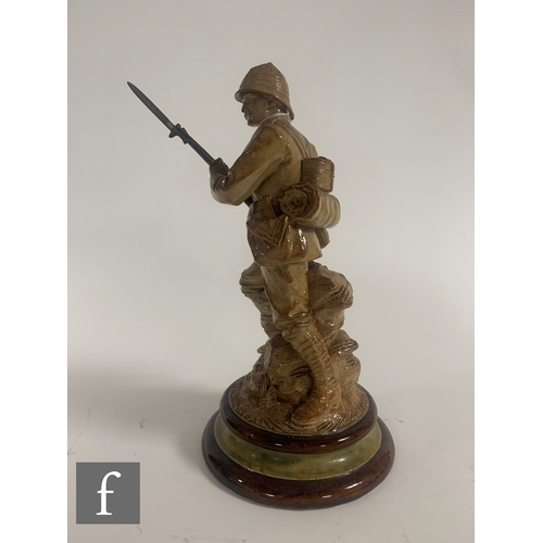 70 - John Broad - Doulton Lambeth - A salt glazed stoneware figure of a Boer War soldier, circa 1901, mod... 