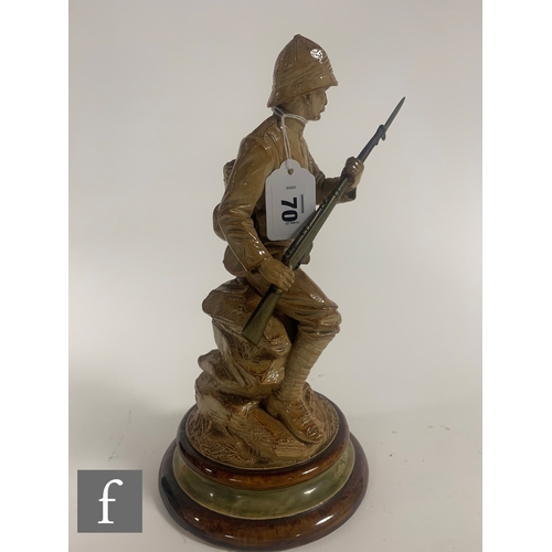 70 - John Broad - Doulton Lambeth - A salt glazed stoneware figure of a Boer War soldier, circa 1901, mod... 