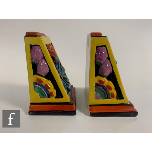 584 - Clarice Cliff - Floreat - A pair of shape 406 book ends circa 1930, relief moulded with stylised abs... 