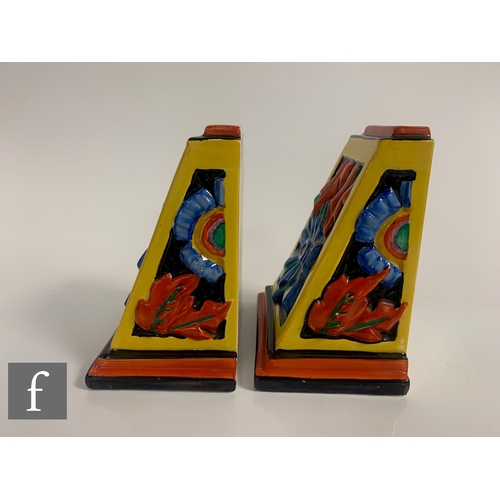 584 - Clarice Cliff - Floreat - A pair of shape 406 book ends circa 1930, relief moulded with stylised abs... 