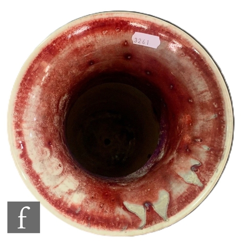 220 - Ruskin Pottery - A High Fired vase and stand, circa 1925, slender shouldered sleeve form with everte... 