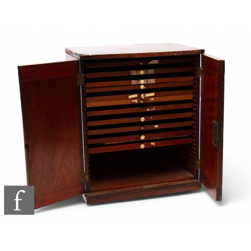 52 - A Edwardian mahogany table top coin cabinet fitted with eleven sliding divisional trays enclosed by ... 