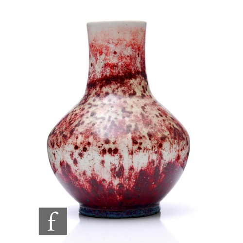 185 - Ruskin - An early 20th Century high fired vase, of shouldered ovoid form with tall collar neck, sang... 