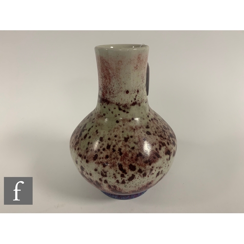 185 - Ruskin - An early 20th Century high fired vase, of shouldered ovoid form with tall collar neck, sang... 