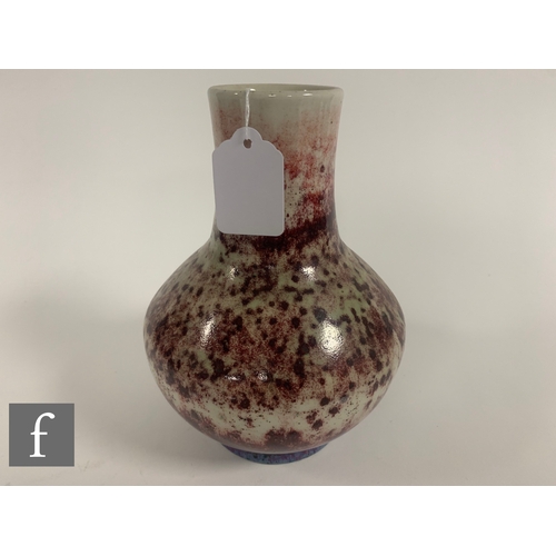 185 - Ruskin - An early 20th Century high fired vase, of shouldered ovoid form with tall collar neck, sang... 