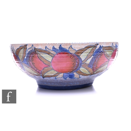 734 - Charlotte Rhead - Crown Ducal - A large 'Granada' pattern bowl, tubeline decorated with a band of st... 