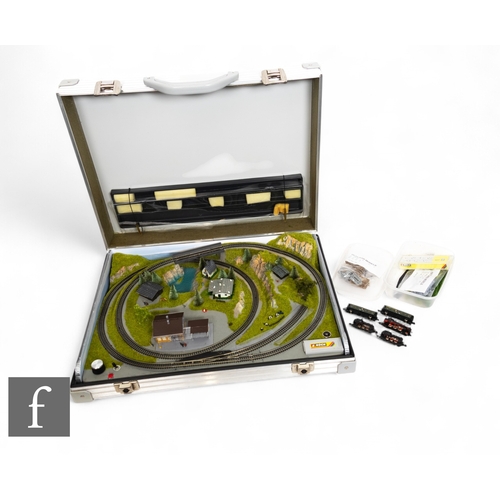 125 - A Noch 'Z' gauge layout with figure-8 with siding layout with Continental buildings and scenery, wit... 