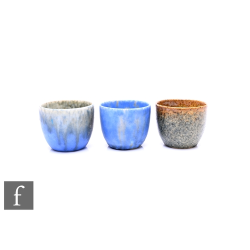 862 - Ruskin Pottery - Three crystalline egg cups, circa 1930, graded ivory to blue, mottled blue and mott... 