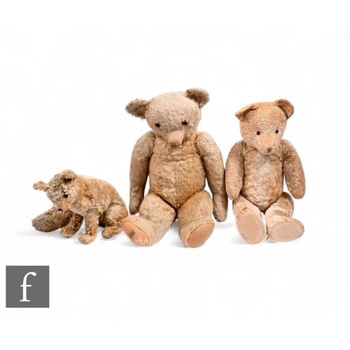 A mid 20th Century Farnell Alpha musical seated fox, mohair body, partial label to base, together with a Merrythought bear, mohair body, sewn on label to foot and button tag to ear, together with another similar teddy bear, longest 67cm. (3)