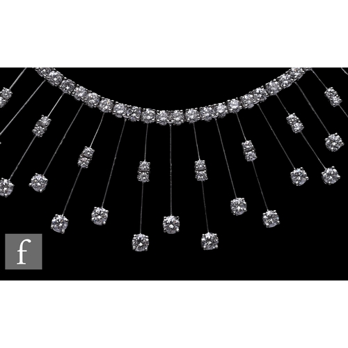 1046 - A diamond fringe necklace, the front section set with a uniform row of brilliant-cut diamonds, suspe... 