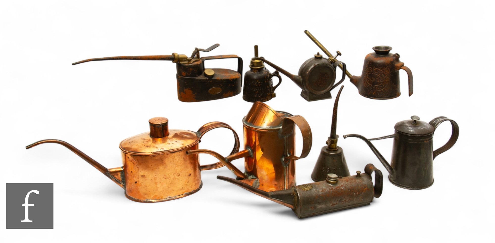 A copper oil can of kettle form, a similar cylindrical example, a cast ...