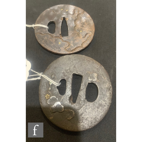 14 - Two Japanese iron Tsuba, both of circular form with trailing foliate design picked out in gilt, diam... 