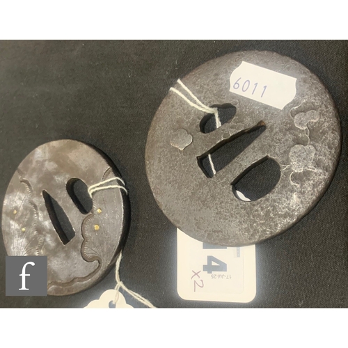 14 - Two Japanese iron Tsuba, both of circular form with trailing foliate design picked out in gilt, diam... 