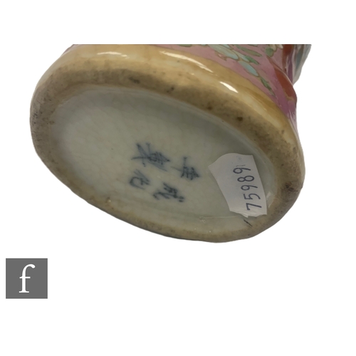 59 - A Chinese famille rose vase, of flattened ovoid form with bird head handles, Qianlong four-character... 