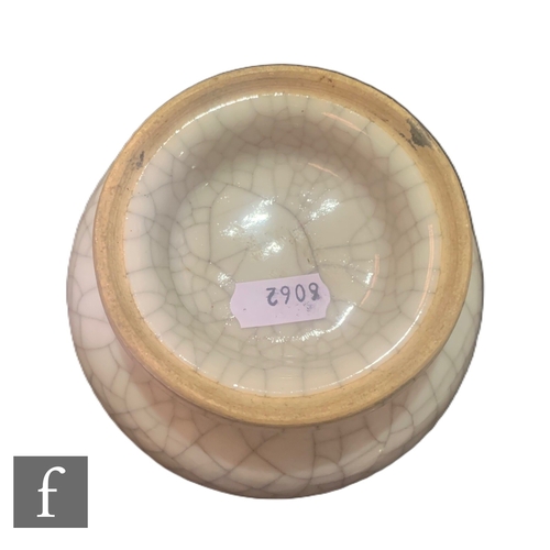 40 - A Chinese Ge-type vase, of pear form rising to a neck with everted rim, and raised on a splayed foot... 