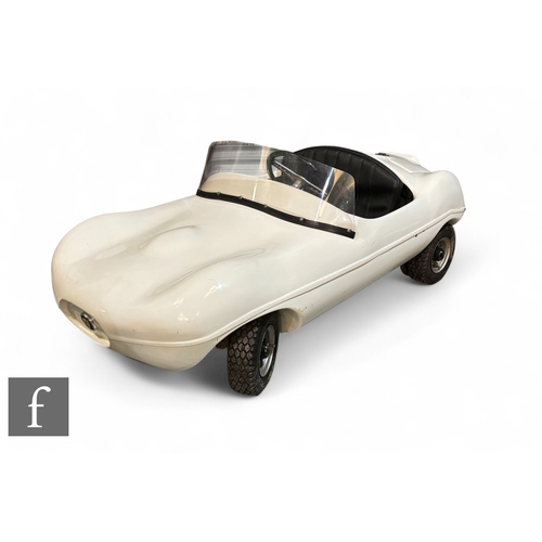 238 - A mid 1950s Cheetah Cub child's 'D-Type Jaguar' racing car built by Watsonian, fiberglass body, powe... 