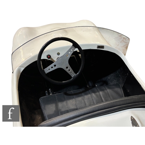 238 - A mid 1950s Cheetah Cub child's 'D-Type Jaguar' racing car built by Watsonian, fiberglass body, powe... 