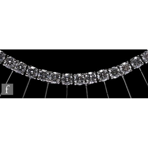 1046 - A diamond fringe necklace, the front section set with a uniform row of brilliant-cut diamonds, suspe... 