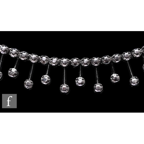 1046 - A diamond fringe necklace, the front section set with a uniform row of brilliant-cut diamonds, suspe... 