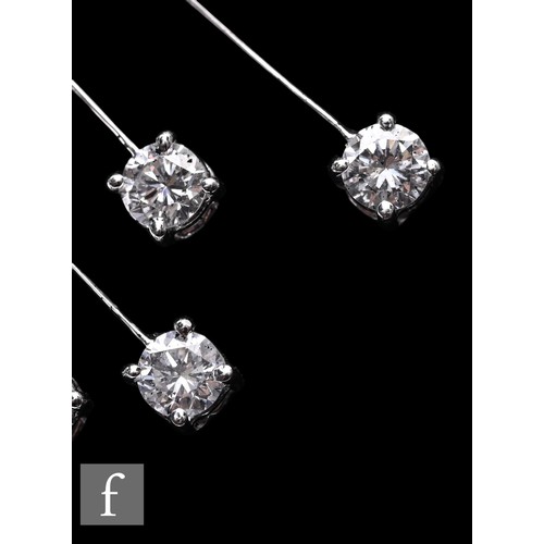 1046 - A diamond fringe necklace, the front section set with a uniform row of brilliant-cut diamonds, suspe... 