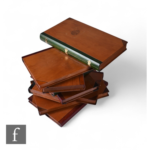 A 20th Century New Zealand Awanui wood stacking book table, the top ...
