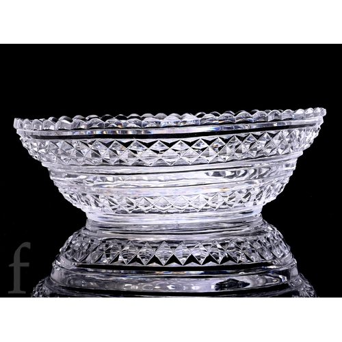 511 - A large late Georgian table centre bowl circa 1800 in the Anglo-Irish taste, the oval body cut with ... 