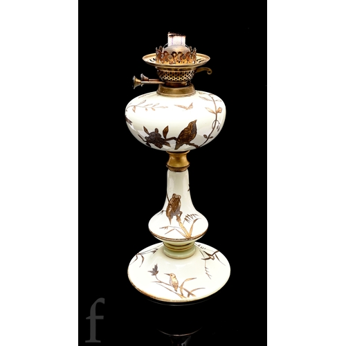 512 - A late 19th Century Stourbridge glass table lamp attributed to Edward Webb, the upper paraffin reser... 