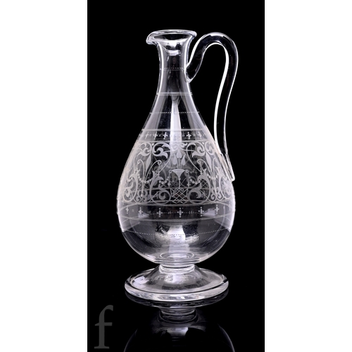 516 - A late 19th Century Stourbridge clear crystal claret jug, the ovoid body with tapered collar neck, h... 