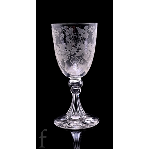 519 - A 19th Century Stourbridge clear crystal glass goblet, the large ovoid bowl engraved with stylised f... 