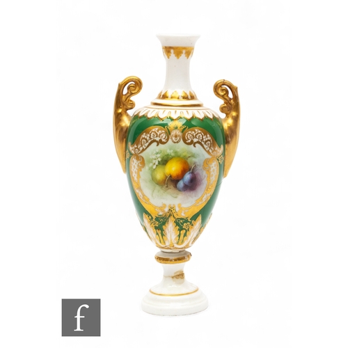 A Frederick Chivers for Royal Worcester, fruit painted vase, circa 1906, twin handled ovoid form on knopped stem and circular footed form, decorated with plums and damsons over moss covered ground within gilded cartouche over apple green ground, signed, teal printed mark, height 16cm.