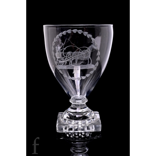 715 - A late Georgian rummer circa 1800, the pointed funnel bowl above a bladed collar and mounted to a le... 