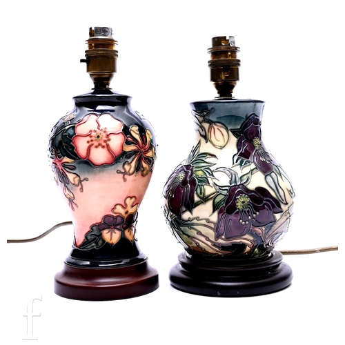465 - Nicola Slaney for Moorcroft Pottery, a 'Hellebore' pattern lamp base, of baluster form on turned woo... 