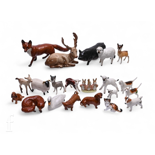 469 - A collection of Beswick animal figures to include, Reindeer (954), Bambi, Sheep, lambs, calf, dogs a... 
