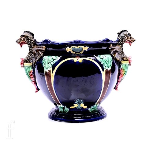 473 - In the Manner of Thomas Forester, a Victorian majolica jardiniere, circa 1890, with applied dragon h... 