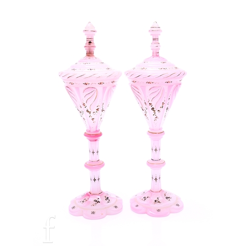 749 - A pair of 19th Century Bohemian pedestal cups and covers, the conical bowl with a stepped cover and ... 