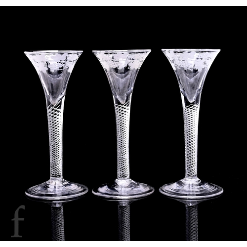 750 - An 18th Century drinking glass circa 1750, the flared trumpet bowl engraved with a fruiting vine bor... 